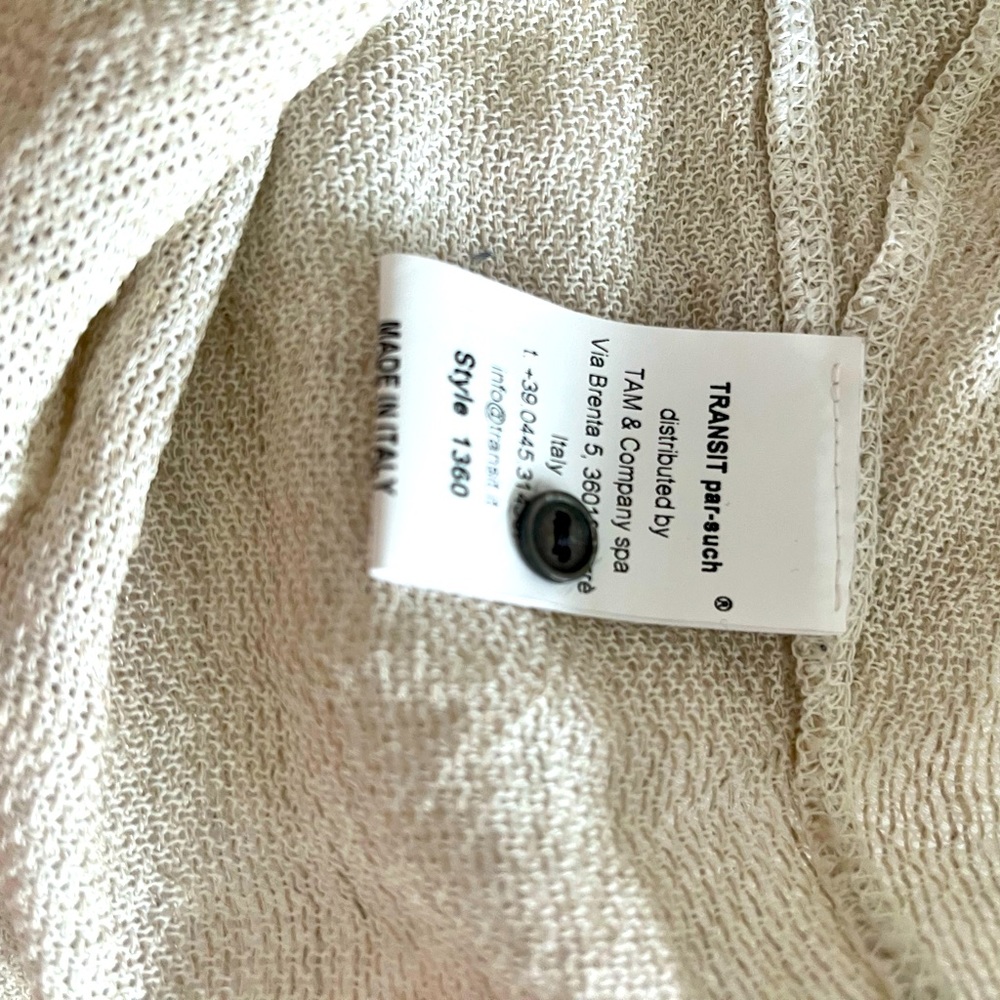 Linen cardigan in cream with black trim. Black buttons. Dry clean only